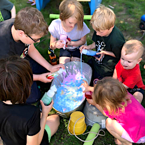 Children playing with bubbles outdoors